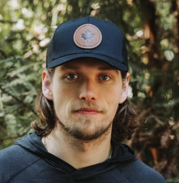 Man wearing dark baseball cap outdoor portrait