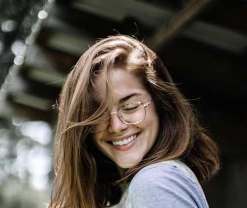 Smiling brunette woman with glasses portrait